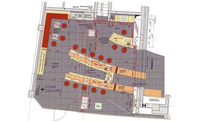 Eine Sitznische mit Lederbezug und Serviceeinbauten in der furnierten Wandverkleidung schaffen eine Lounge Atmosphäre und laden zum gemütlichen Verweilen ein.