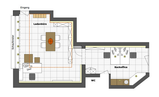 Der Grundriss zeigt die Aufteilung von Laden und Backoffice in verschiedene Raumzonen. Polierte Fliesen aus Feinsteinzeug bilden den Bodenbelag mit Großformaten.