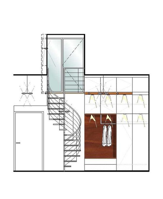 Die offene Garderobe innerhalb des Einbauschrankes gibt der Treppe mehr Volumen im Raum und setzt sie gleichzeitig in Szene. Der Nussbaum schafft Atmosphäre.