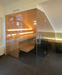Interior Designer Andreas Ptatscheck, München, gestaltete das Interior Design des Wellnessbades passend zur Innenarchitektur der Doppelhaushälfte, Sauna als Panoramasauna mit Glaswänden.